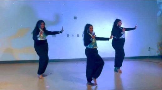 Three dancers performing to Uppukaruvadu