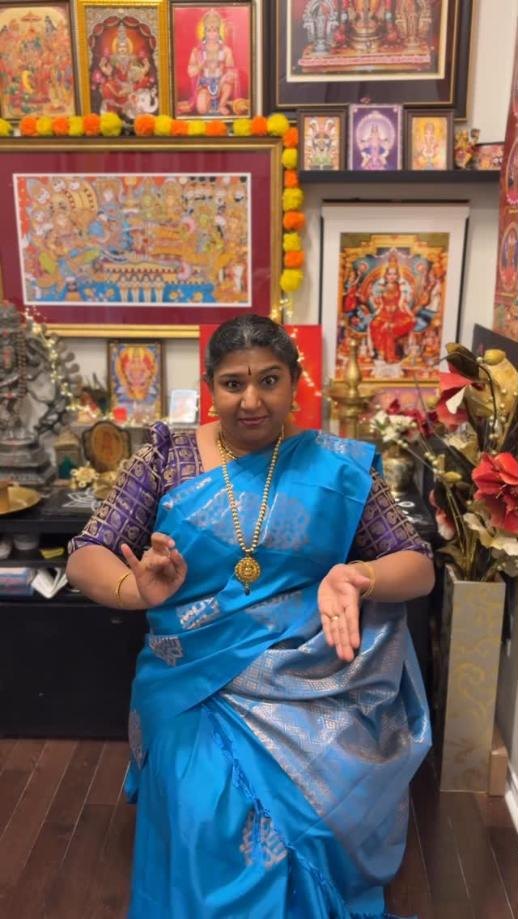 Vardhini Venkat, founder of Masakali, performing a classical expression in a blue silk saree